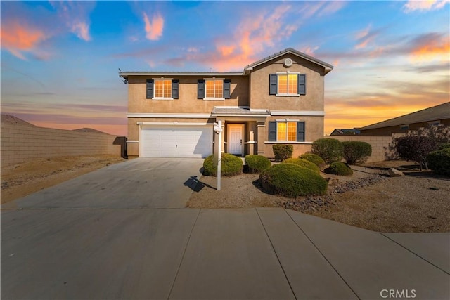 42570 72nd St W, Lancaster, CA 93536 - traditional-style house with fence, a garage, driveway, and stucco siding