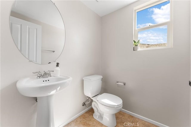 42570 72nd St W, Lancaster, CA 93536 - bathroom featuring baseboards, a sink, tile patterned flooring, and toilet