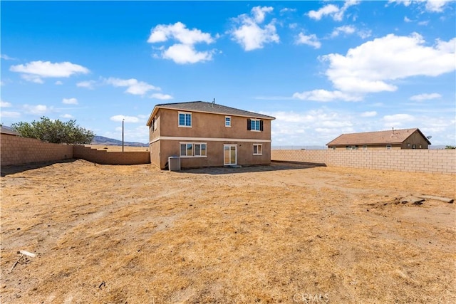 42570 72nd St W, Lancaster, CA 93536 - rear view of house with a fenced backyard and stucco siding