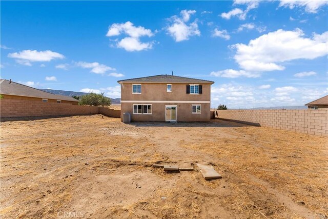 42570 72nd St W, Lancaster, CA 93536 - back of house with a fenced backyard, stucco siding, and central AC unit