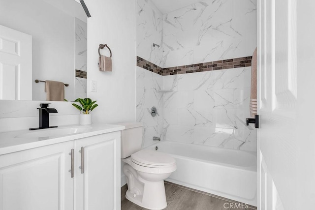 full bath with vanity, shower / bathing tub combination, toilet, and wood finished floors