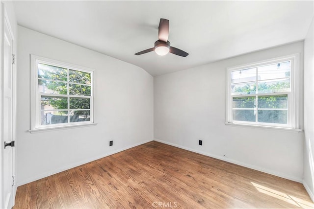 unfurnished room with light wood-style floors, baseboards, and ceiling fan