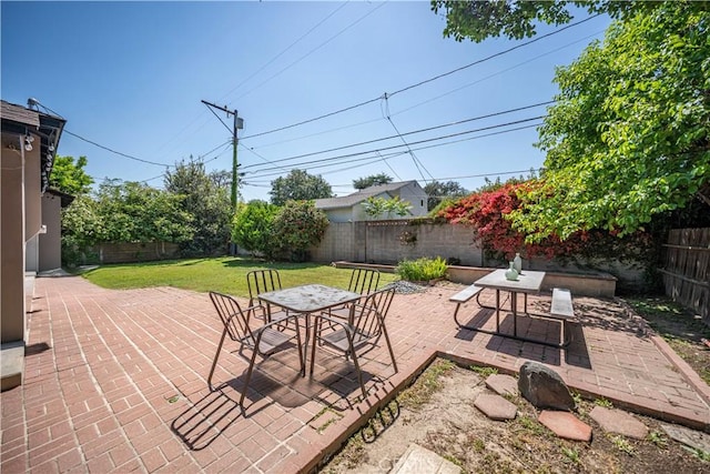 view of patio / terrace featuring outdoor dining area and a fenced backyard