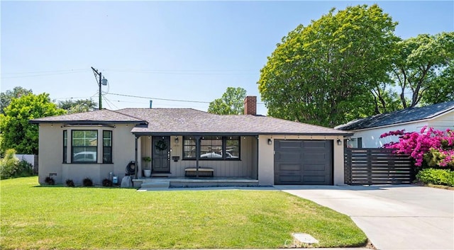 ranch-style home with a front lawn, fence, a chimney, an attached garage, and driveway