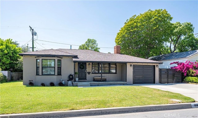 ranch-style home featuring a garage, a front lawn, stucco siding, a chimney, and driveway