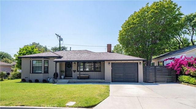single story home with a front lawn, a garage, stucco siding, a chimney, and concrete driveway
