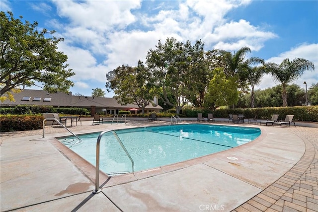 pool with a patio area