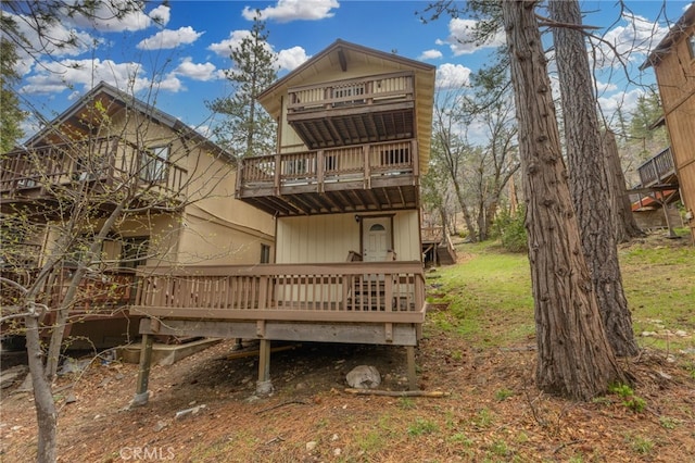 2368 Pine Dr, Running Springs, CA 92382 - rear view of house featuring a balcony and a wooden deck