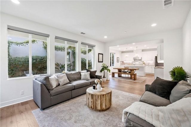 1253 Viejo Hills Dr, Lake Forest, CA 92610 - living area featuring light wood-type flooring, recessed lighting, and baseboards