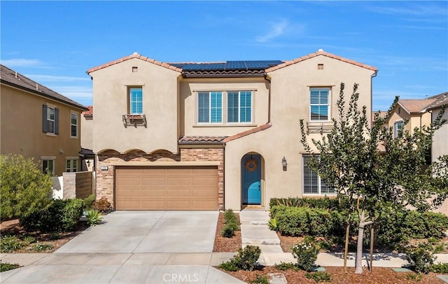 1253 Viejo Hills Dr, Lake Forest, CA 92610 - mediterranean / spanish-style home featuring a tile roof, stucco siding, and roof mounted solar panels