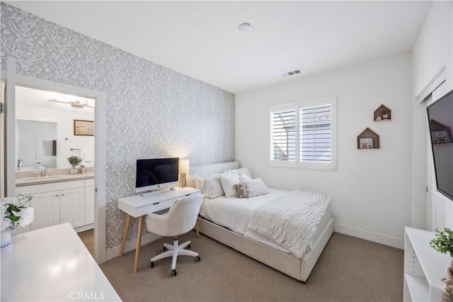1253 Viejo Hills Dr, Lake Forest, CA 92610 - bedroom with wallpapered walls, a sink, light colored carpet, baseboards, and connected bathroom
