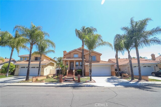 3667 Sonoma Oaks Ave, Perris, CA 92571 - traditional home with a tiled roof, driveway, and stucco siding