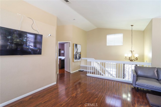 3667 Sonoma Oaks Ave, Perris, CA 92571 - hall with lofted ceiling, wood finished floors, baseboards, a notable chandelier, and an upstairs landing