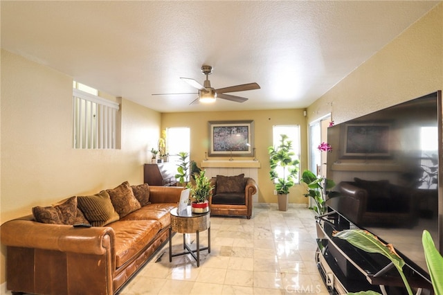 3667 Sonoma Oaks Ave, Perris, CA 92571 - living room featuring ceiling fan and marble finish floor