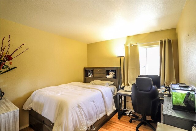 3667 Sonoma Oaks Ave, Perris, CA 92571 - bedroom with a textured wall and wood finished floors