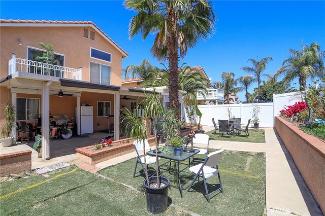 3667 Sonoma Oaks Ave, Perris, CA 92571 - view of patio with outdoor dining area, ceiling fan, fence, and a balcony