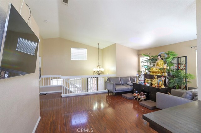 3667 Sonoma Oaks Ave, Perris, CA 92571 - living room featuring visible vents, wood finished floors, a notable chandelier, and vaulted ceiling