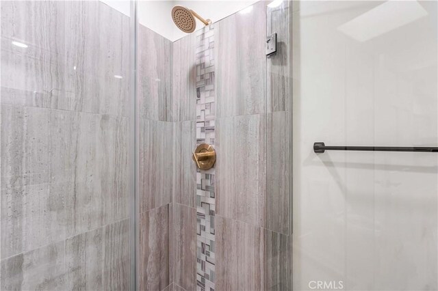 full bath with a shower stall