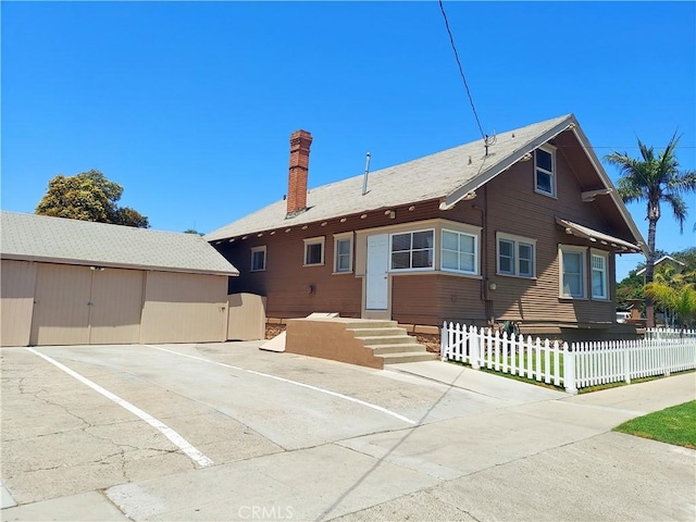530 S Broadway, Santa Ana, CA 92701 - view of front of house featuring a chimney and fence