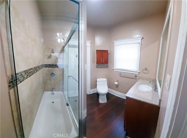 530 S Broadway, Santa Ana, CA 92701 - bathroom with a shower with door, toilet, wood finished floors, vanity, and baseboards