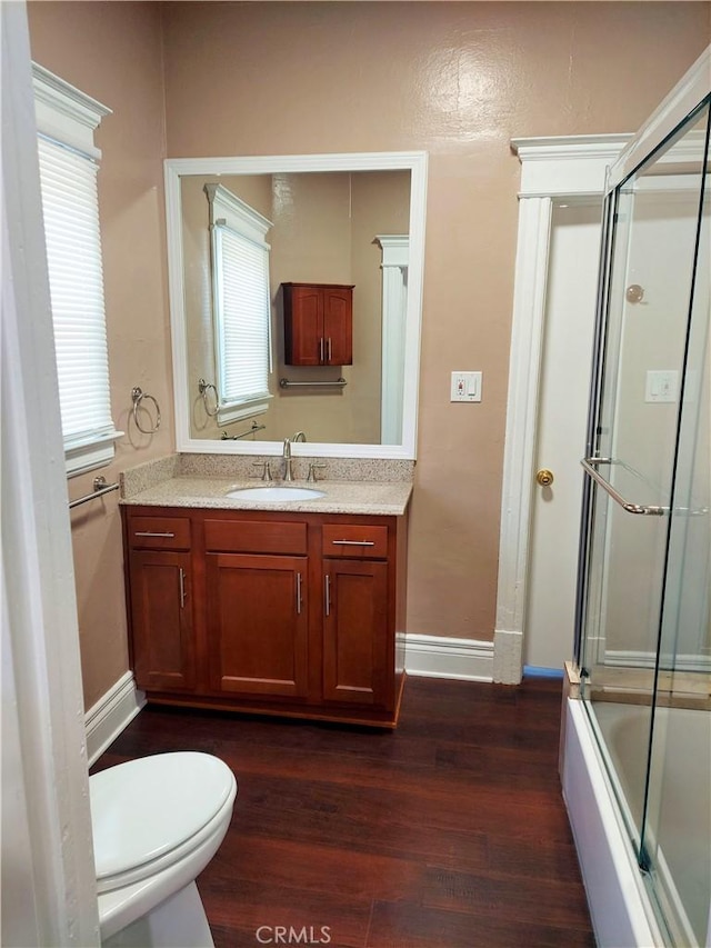 530 S Broadway, Santa Ana, CA 92701 - full bath featuring wood finished floors, healthy amount of natural light, toilet, and vanity