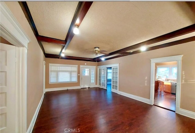 530 S Broadway, Santa Ana, CA 92701 - empty room featuring a textured ceiling, a ceiling fan, dark wood finished floors, baseboards, and beamed ceiling