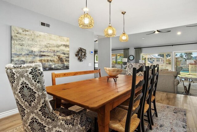 dining space featuring visible vents, recessed lighting, and wood finished floors