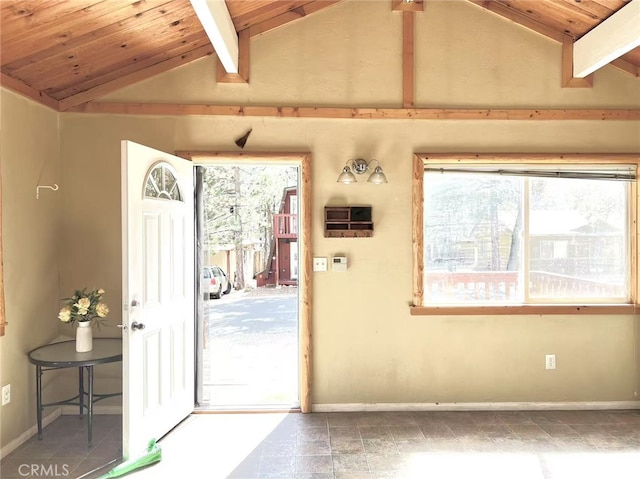 entryway with baseboards, lofted ceiling with beams, and wood ceiling
