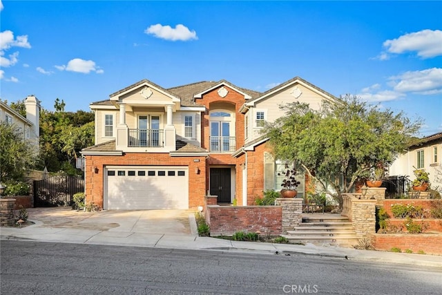 18345 Watson Way, Yorba Linda, CA 92886 - view of front of home featuring driveway, french doors, fence, a balcony, and an attached garage