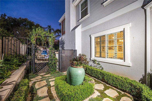 18345 Watson Way, Yorba Linda, CA 92886 - view of side of home featuring fence, a gate, and stucco siding