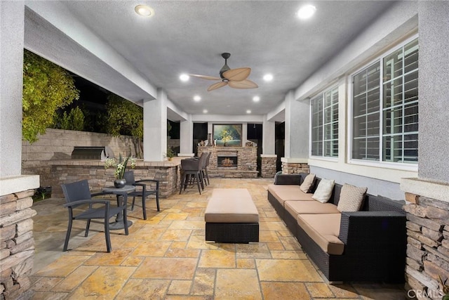 18345 Watson Way, Yorba Linda, CA 92886 - view of patio featuring area for grilling, a bar, a ceiling fan, and an outdoor living space with a fireplace