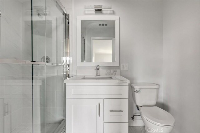 full bathroom with toilet, visible vents, a shower stall, and vanity
