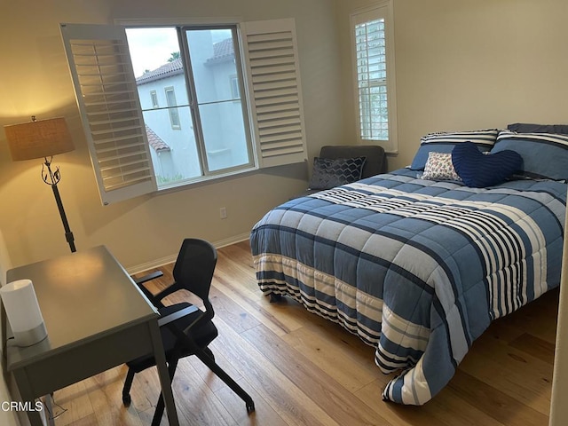 1117 Patel Pl, Duarte, CA 91010 - bedroom featuring baseboards, multiple windows, and wood finished floors