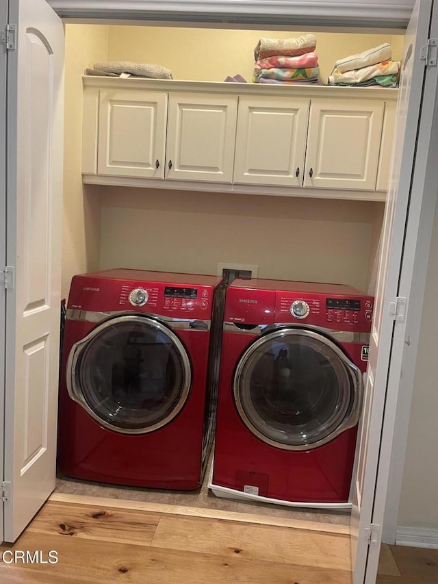 1117 Patel Pl, Duarte, CA 91010 - washroom featuring separate washer and dryer, cabinet space, and light wood finished floors