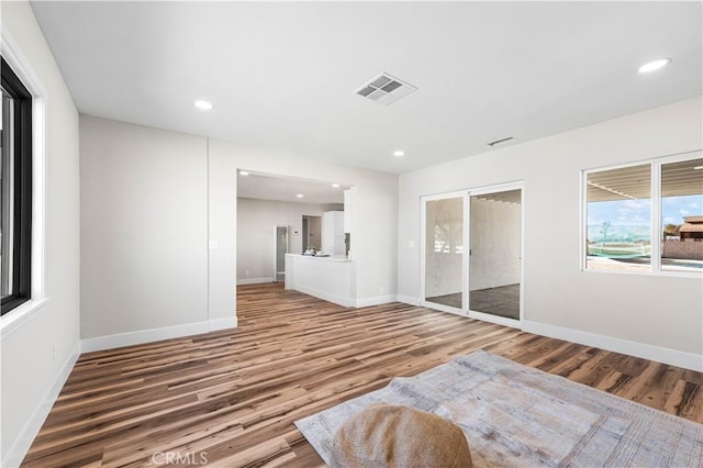 unfurnished bedroom with recessed lighting, baseboards, light wood finished floors, and visible vents