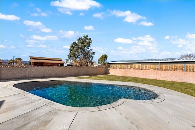 view of pool with a patio, a fenced in pool, and a fenced backyard