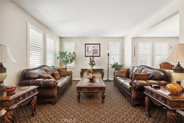 living room with baseboards and carpet