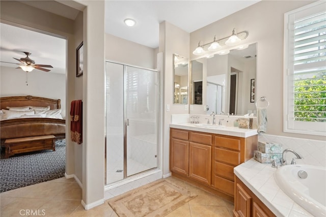 bathroom featuring a garden tub, tile patterned flooring, ensuite bathroom, ceiling fan, and a shower stall