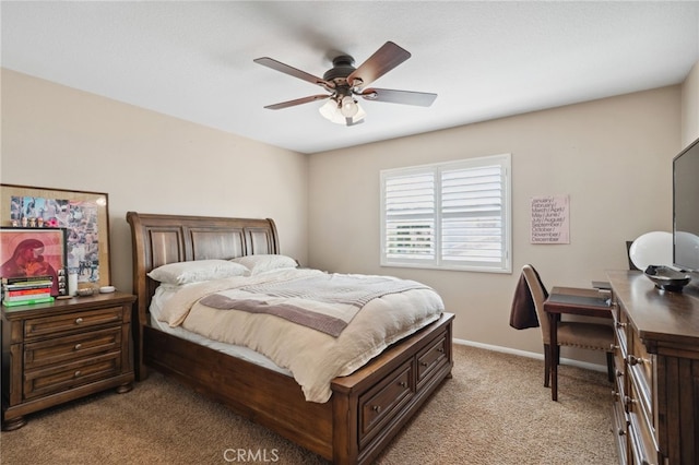 bedroom with baseboards, a ceiling fan, and light colored carpet