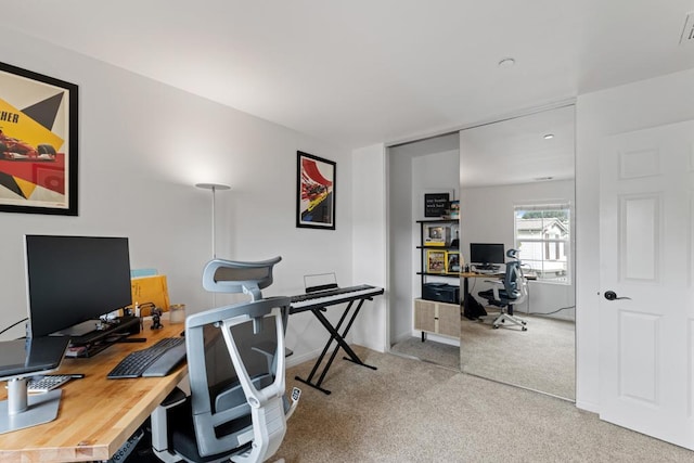 home office featuring carpet flooring and visible vents