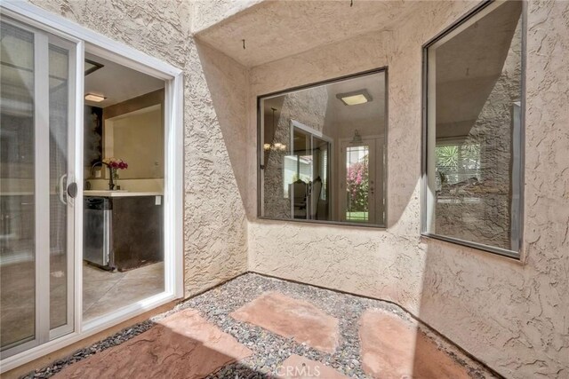 doorway to property with stucco siding