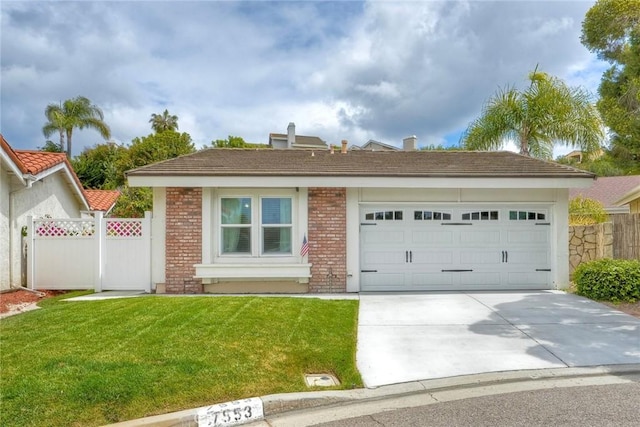 ranch-style house featuring a garage, fence, a front yard, brick siding, and driveway