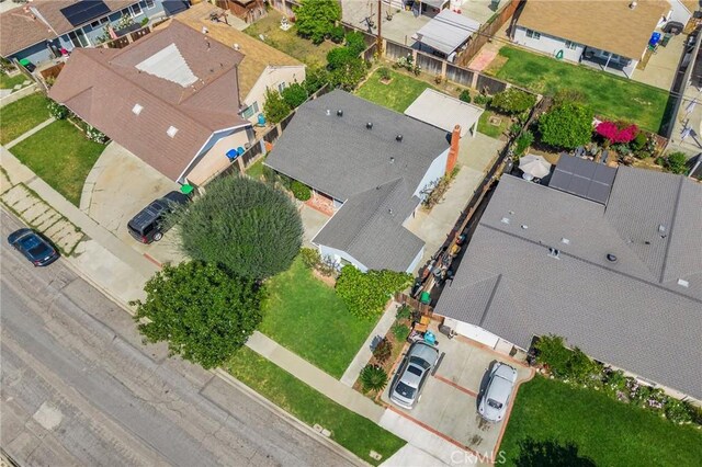 birds eye view of property with a residential view