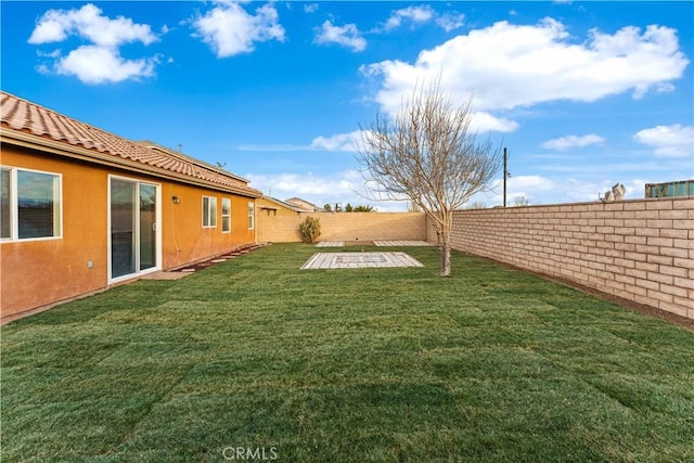 view of yard featuring a fenced backyard and a patio area