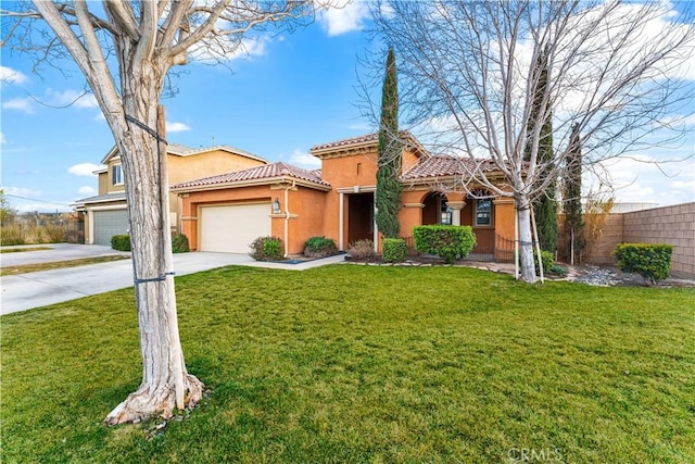 mediterranean / spanish-style home featuring fence, a front yard, stucco siding, a tiled roof, and concrete driveway