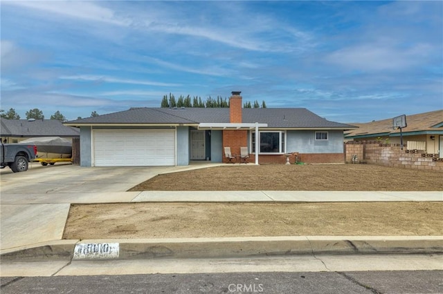 15010 Oakwood Ln, Chino Hills, CA 91709 - ranch-style house with brick siding, a garage, driveway, and a chimney