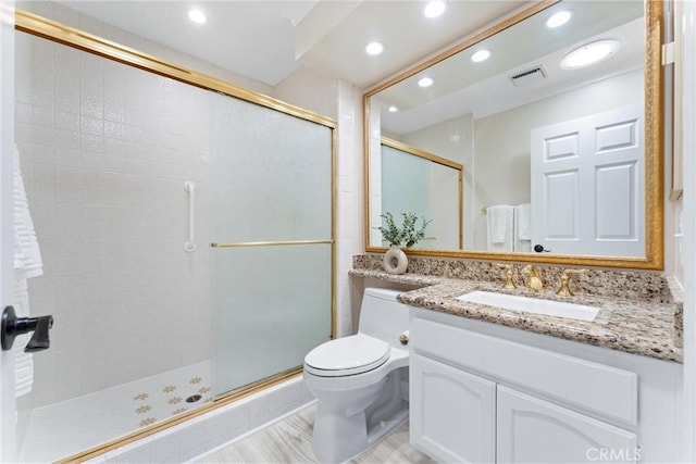bathroom featuring recessed lighting, visible vents, and a shower stall