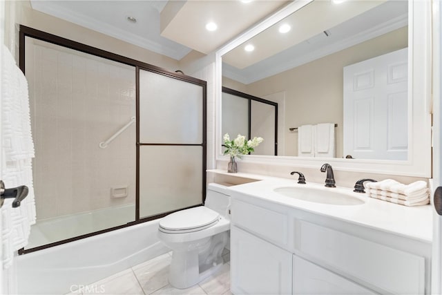 bathroom featuring crown molding, enclosed tub / shower combo, toilet, and vanity