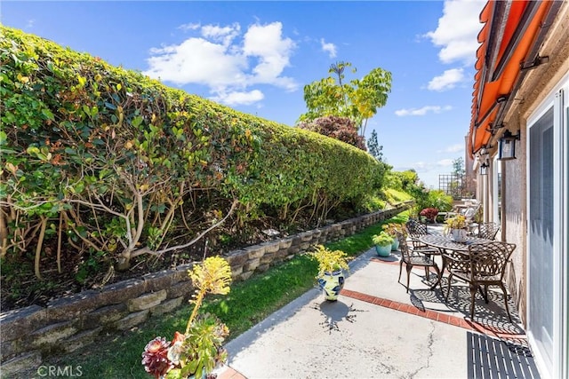 view of patio with outdoor dining area