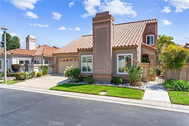 mediterranean / spanish-style house with a tiled roof, a chimney, concrete driveway, an attached garage, and stucco siding